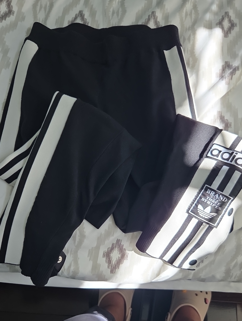 Adidas Black Track Pants with White Three-Stripe Accents
